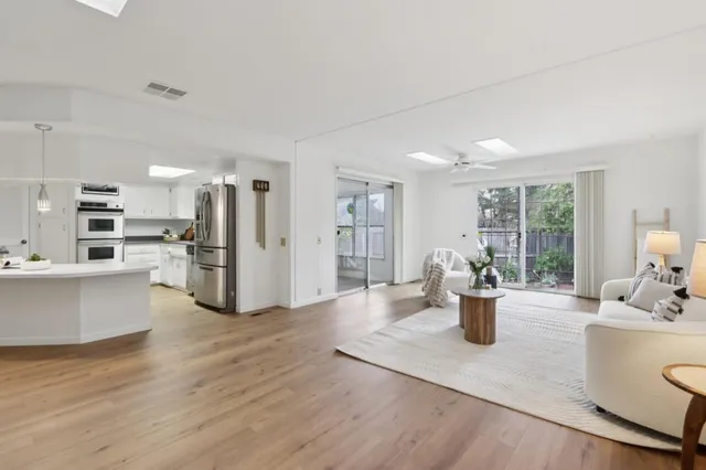 a view of kitchen with cabinets and wooden floor