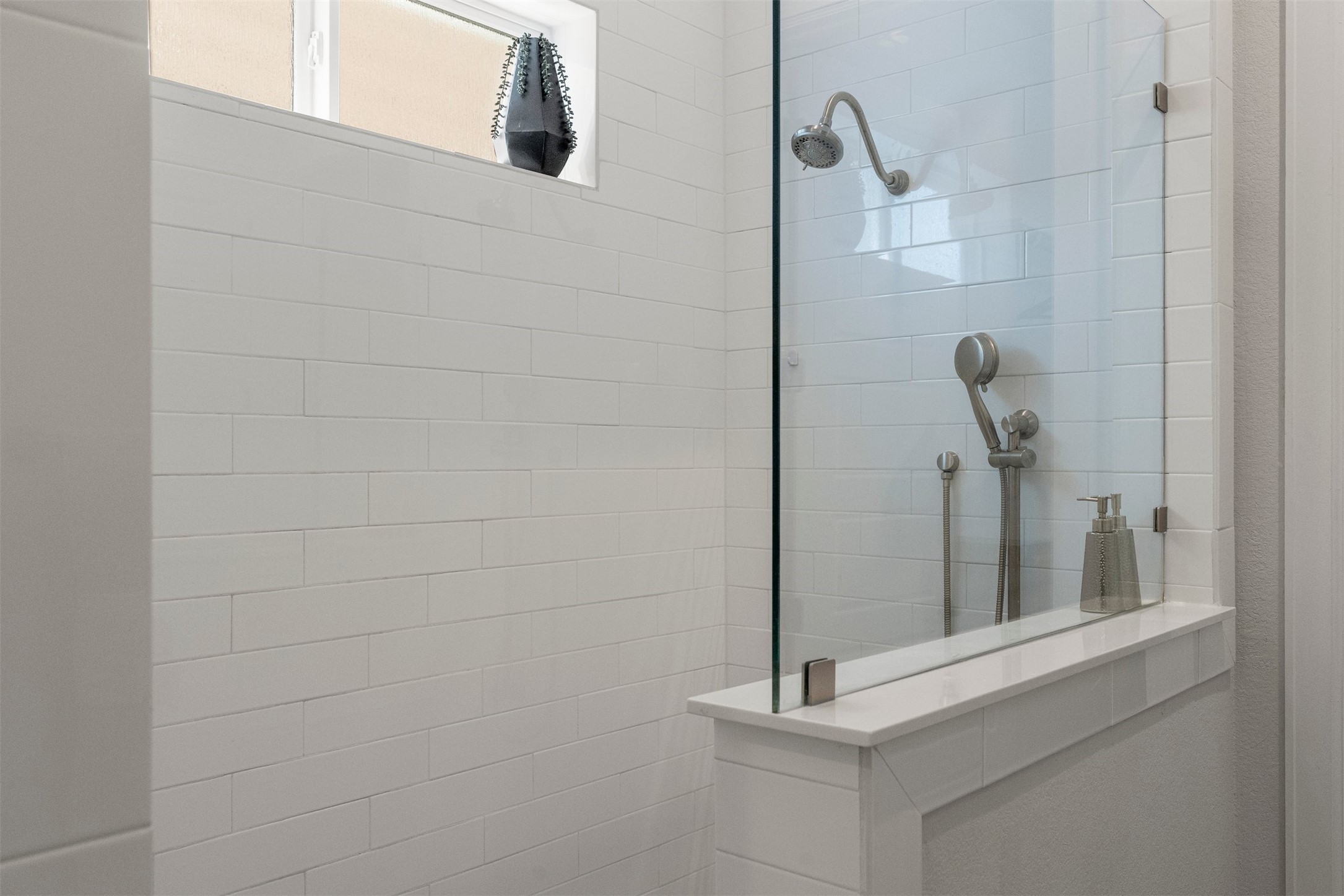4313 Vaughan Street Austin, TX 78723 - Photo 24 of 39 The seamless open shower offers a clean look and practical design within the spacious primary bathroom