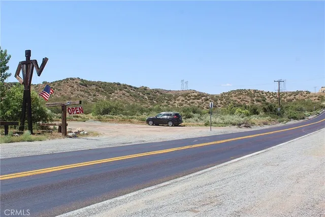 a view of a road with a ocean view