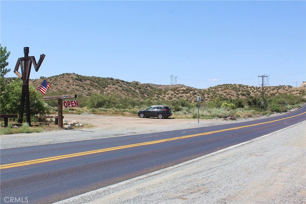 a view of a road with a ocean view