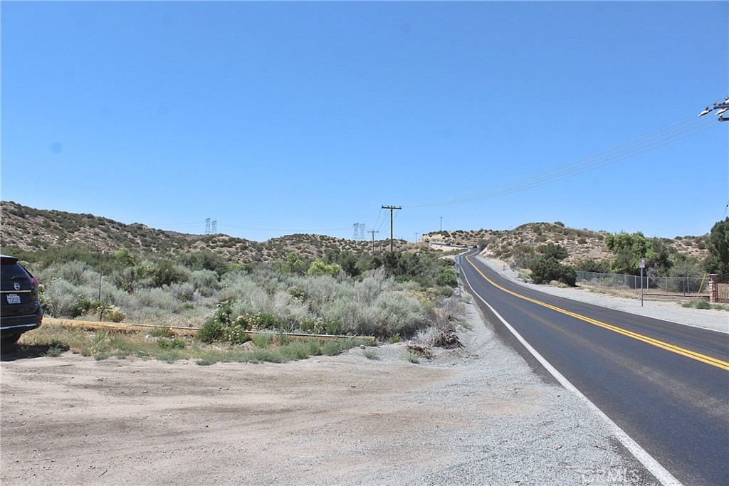 4550 Summit Valley Road Hesperia, CA 92345 - Photo 18 of 19 a view of a road with a mountain in the background