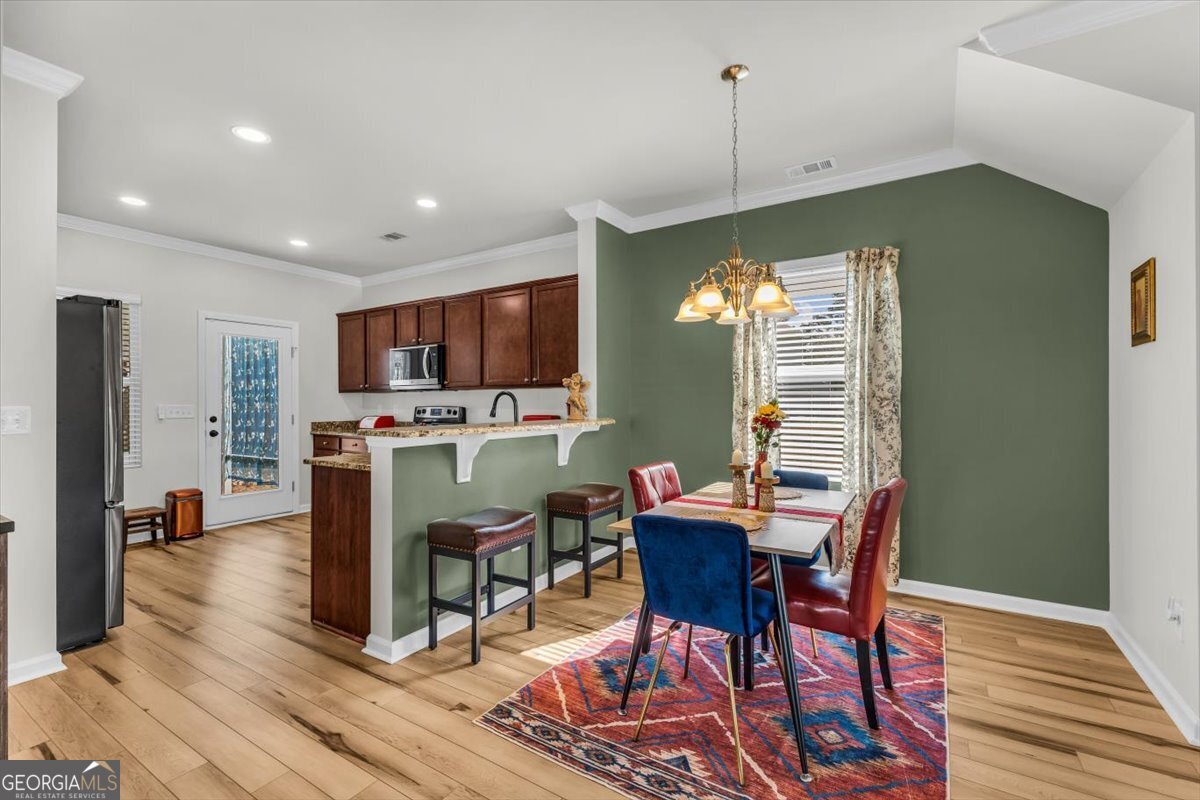 2 Crestview Circle Pooler, GA 31322 - Photo 11 of 55 a view of a dining room with furniture window and wooden floor