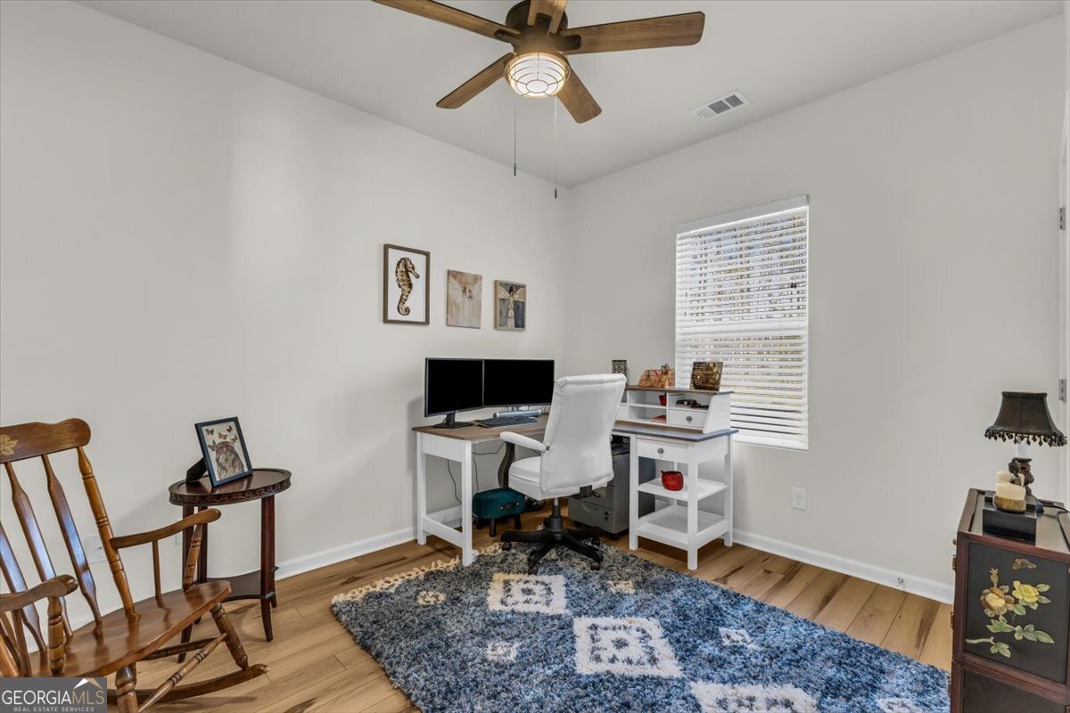 2 Crestview Circle Pooler, GA 31322 - Photo 17 of 55 a workspace with wooden floor and a rug