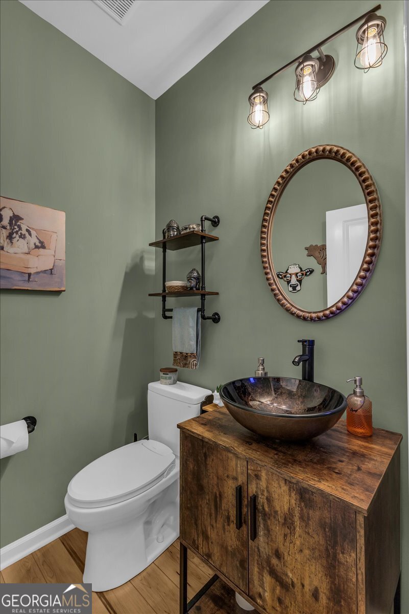 2 Crestview Circle Pooler, GA 31322 - Photo 20 of 55 a bathroom with a sink mirror and toilet