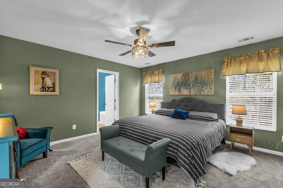 2 Crestview Circle Pooler, GA 31322 - Photo 24 of 55 a bedroom with a bed and a chandelier
