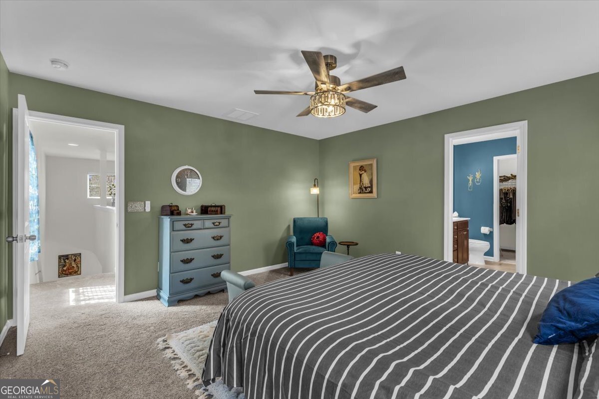 2 Crestview Circle Pooler, GA 31322 - Photo 25 of 55 a bedroom with a bed and a chandelier