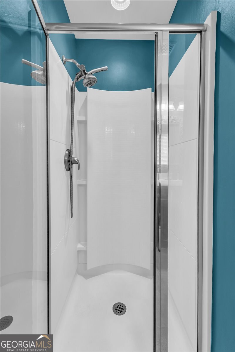 2 Crestview Circle Pooler, GA 31322 - Photo 31 of 55 a bathroom with a glass shower door