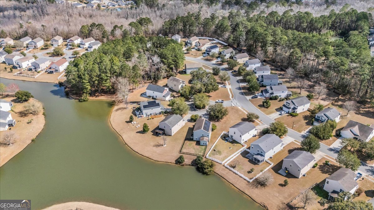 2 Crestview Circle Pooler, GA 31322 - Photo 53 of 55 an aerial view of a house with a yard and lake view