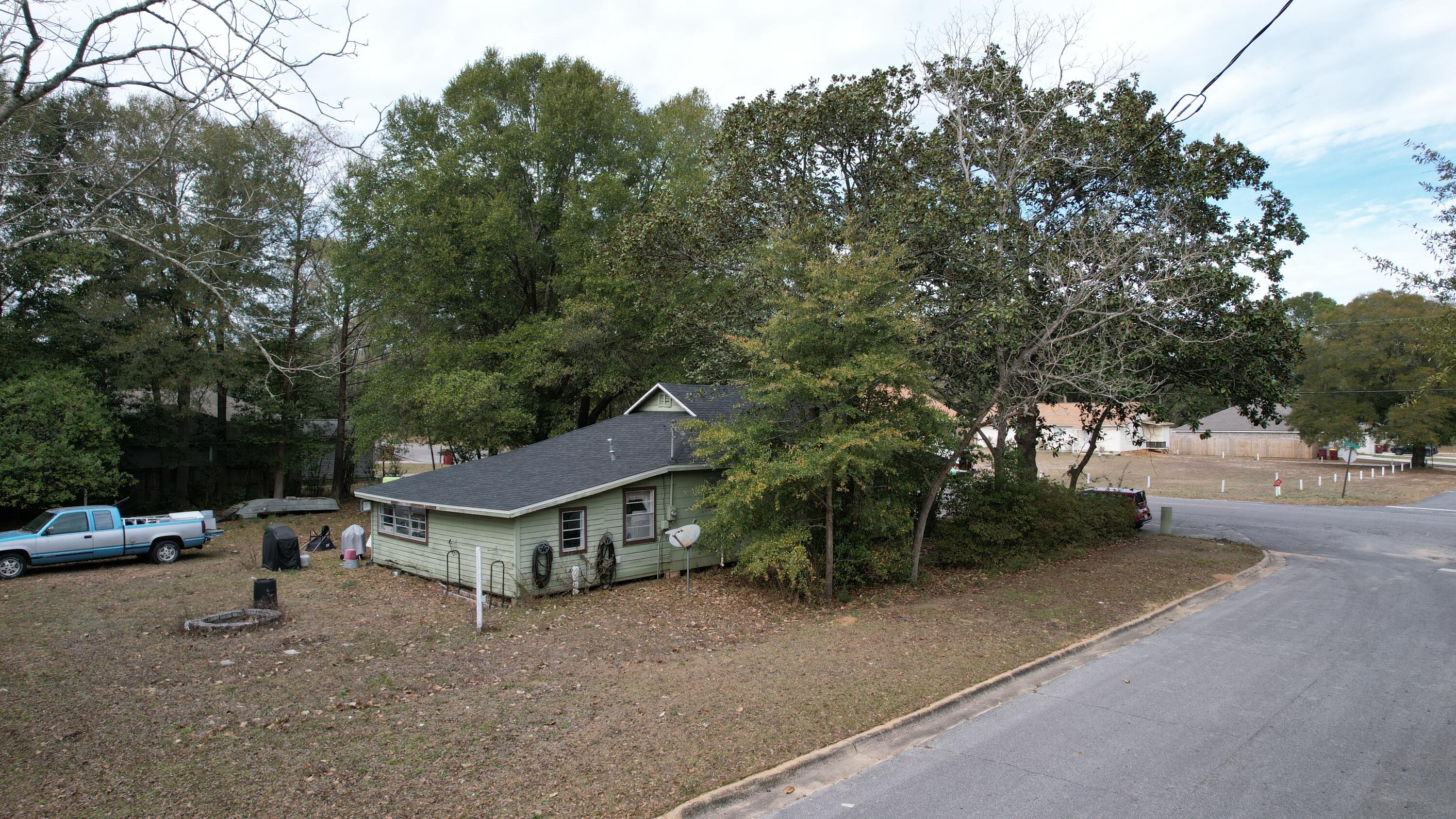 625 East Chestnut Avenue Crestview, FL 32539 - Photo 16 of 19 a view of a house with a outdoor space