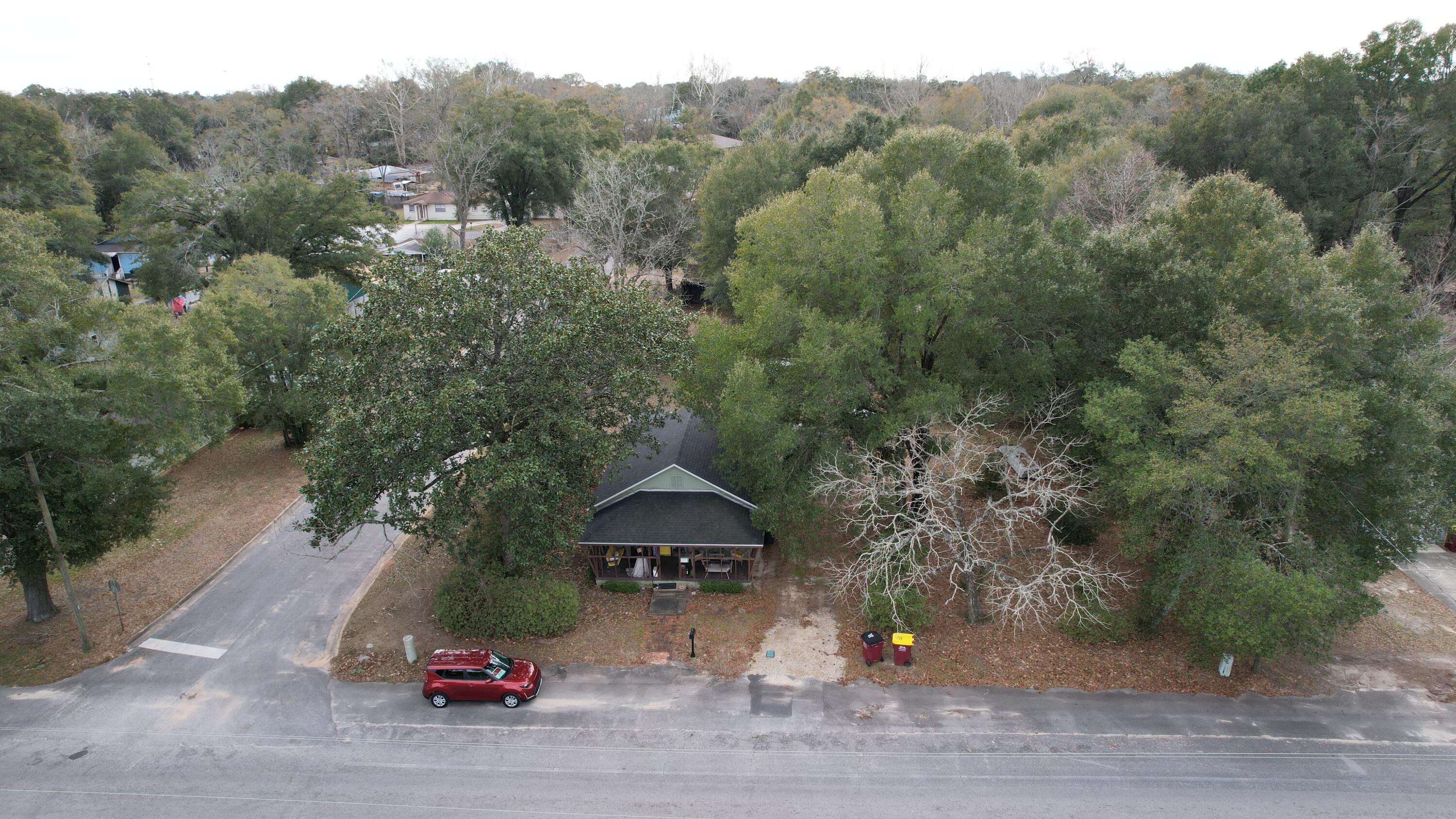 625 East Chestnut Avenue Crestview, FL 32539 - Photo 2 of 19 an aerial view of a house with a street