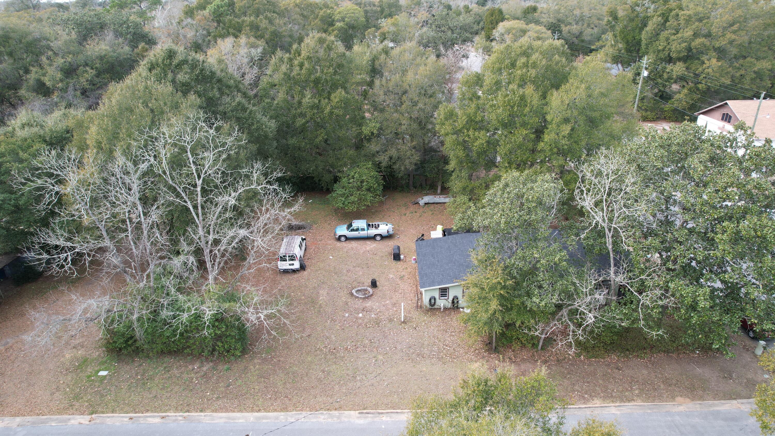 625 East Chestnut Avenue Crestview, FL 32539 - Photo 4 of 19 an aerial view of a house with yard swimming pool and outdoor seating