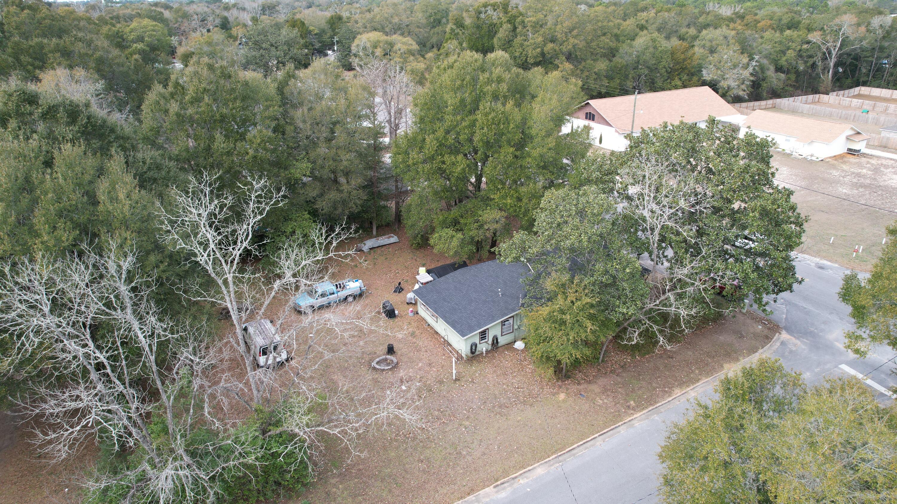 625 East Chestnut Avenue Crestview, FL 32539 - Photo 5 of 19 an aerial view of a house with yard