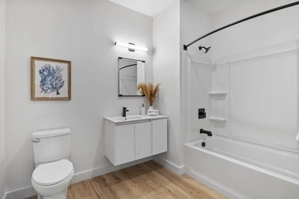 a bathroom with a toilet sink and bathtub