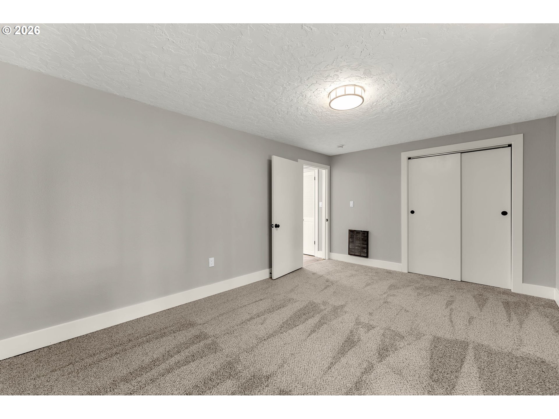 30921 Northwest Spencer Road La Center, WA 98642 - Photo 17 of 39 a view of an empty room with wooden floor