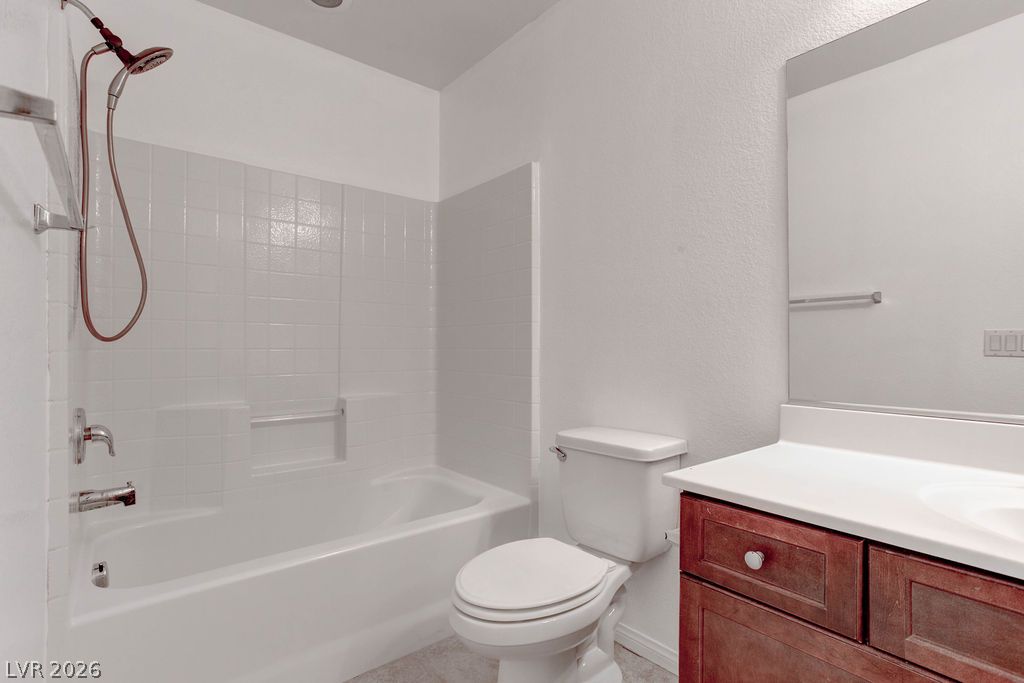 4650 Ranch House Road, Unit 47 North Las Vegas, NV 89031 - Photo 32 of 43 A well-appointed bathroom features a combined shower and bathtub, alongside a sleek vanity with ample storage.