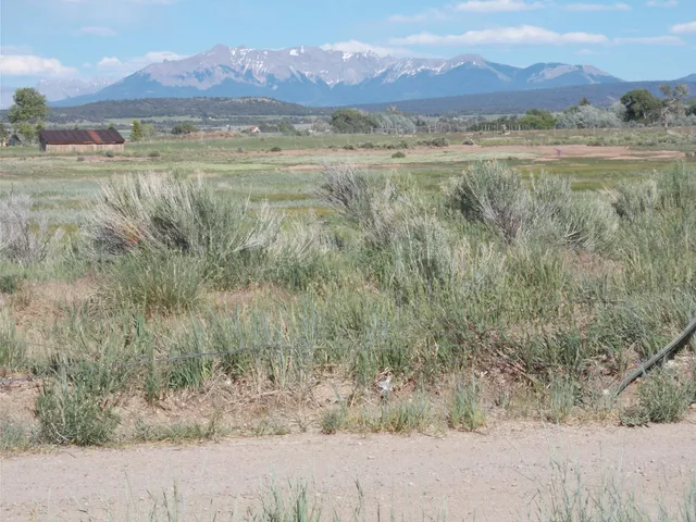 a view of a mountain with a lake view