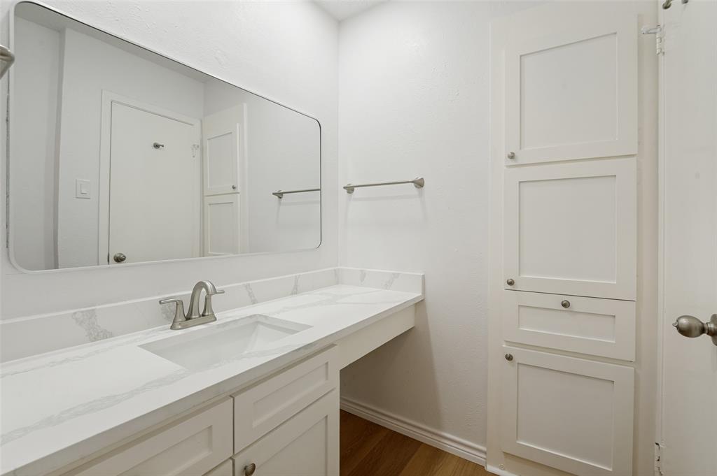 5300 Keller Springs Road, Unit 2042 Dallas, TX 75248 - Photo 22 of 28 Contemporary bathroom vanity with a single undermount sink and brushed nickel faucet