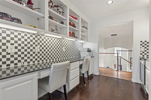 a bedroom with a white bed and a cabinets