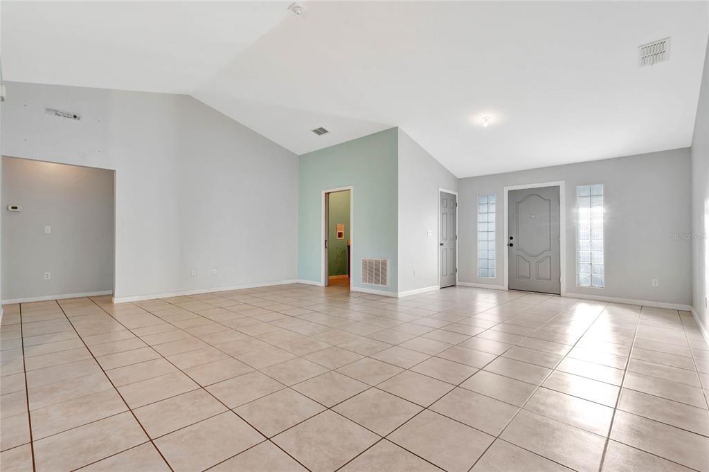 2443 Waterfall Drive Spring Hill, FL 34608 - Photo 12 of 35 a view of an empty room with a window