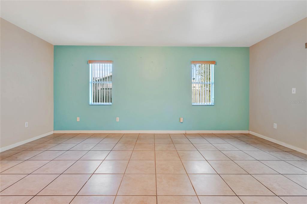 2443 Waterfall Drive Spring Hill, FL 34608 - Photo 27 of 35 an empty room with windows