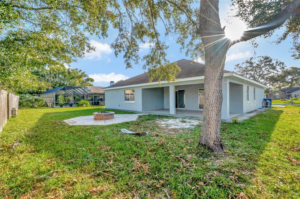 2443 Waterfall Drive Spring Hill, FL 34608 - Photo 32 of 35 a view of a house with a backyard