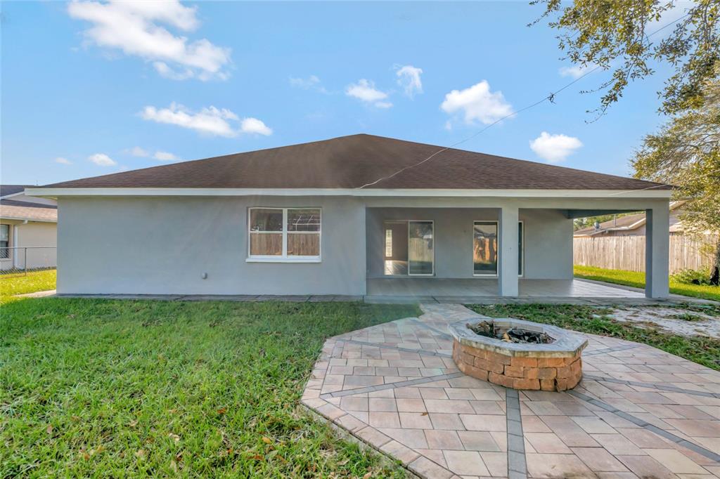 2443 Waterfall Drive Spring Hill, FL 34608 - Photo 33 of 35 a front view of a house with garden
