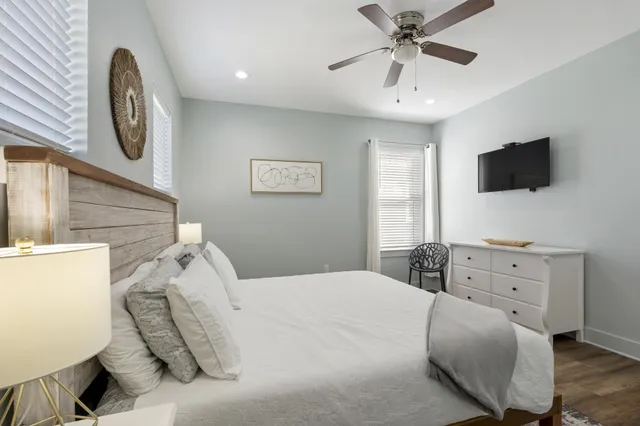 a bedroom with a bed and a flat screen tv