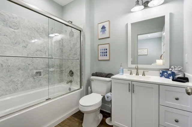 a bathroom with a toilet sink and shower