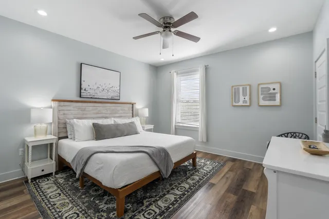 a bedroom with a bed and a table in it