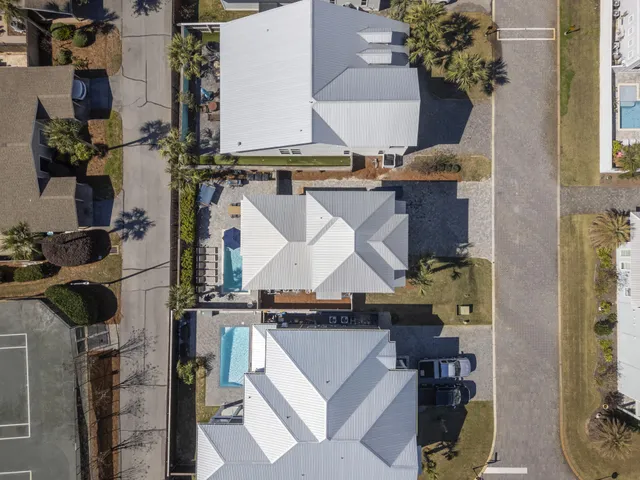 an aerial view of houses with an outdoor space