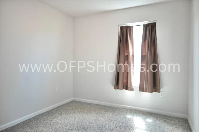 a kitchen with stainless steel appliances a stove a microwave and a refrigerator