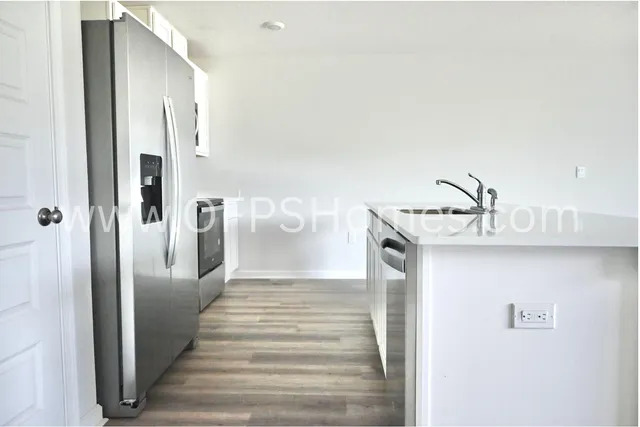 a view of kitchen with kitchen island microwave and stove