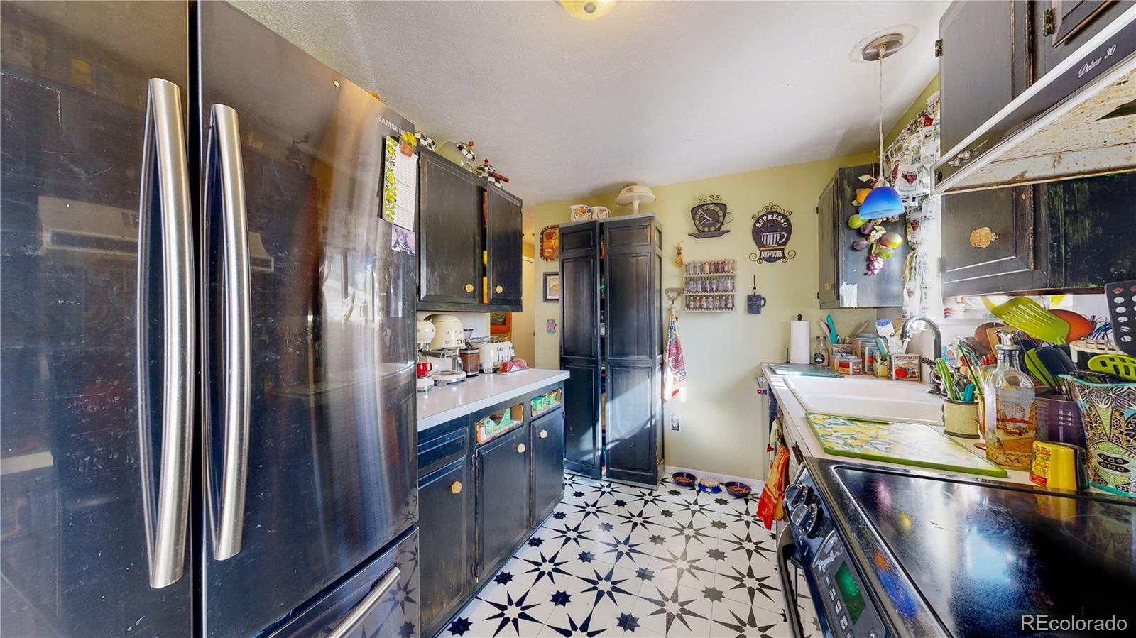 708 Independence Drive Longmont, CO 80504 - Photo 12 of 40 a room with lots of stuff and lots of wooden furniture