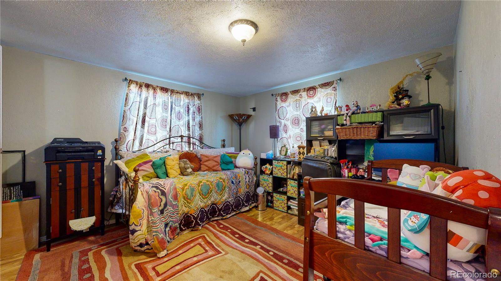 708 Independence Drive Longmont, CO 80504 - Photo 16 of 40 a bedroom with two beds and a window