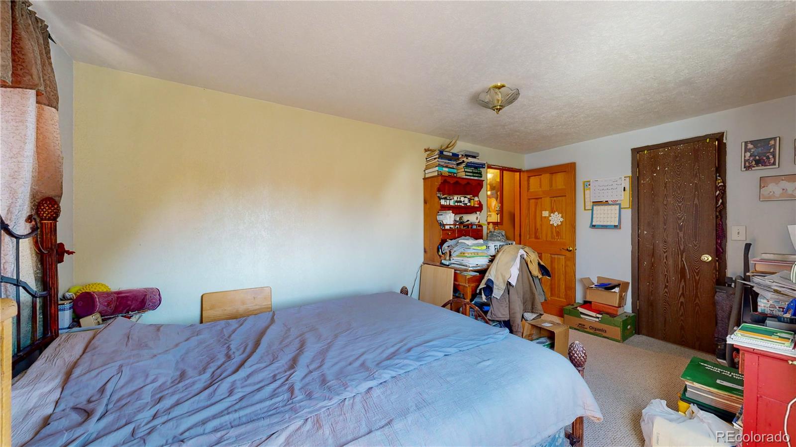 708 Independence Drive Longmont, CO 80504 - Photo 18 of 40 a bedroom with a bed and a desk
