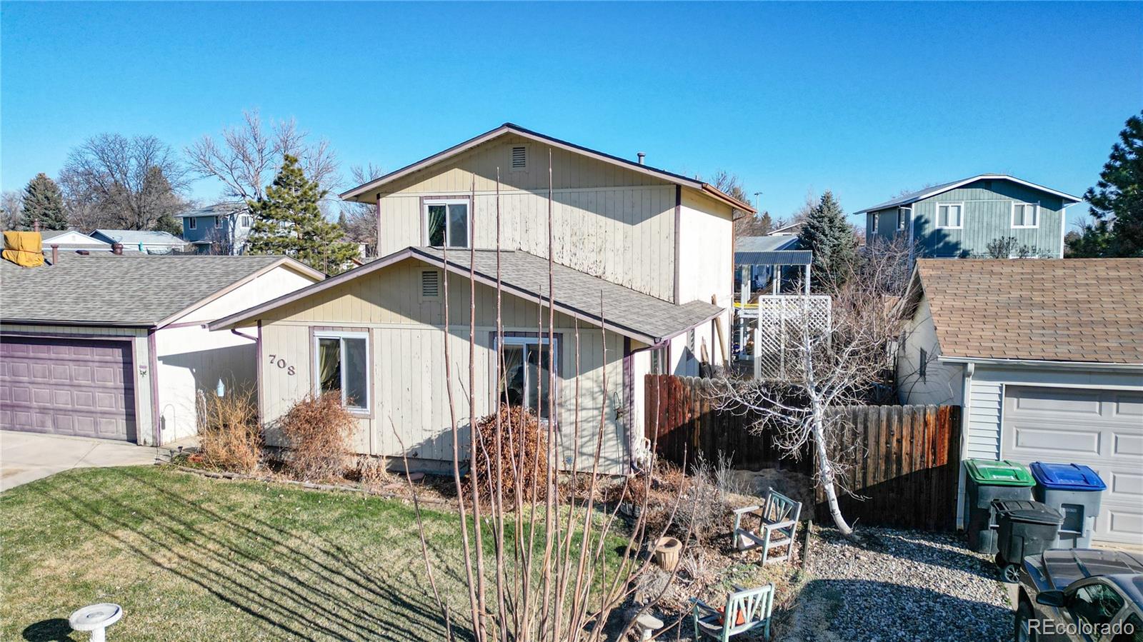 708 Independence Drive Longmont, CO 80504 - Photo 22 of 40 a front view of a house with a yard