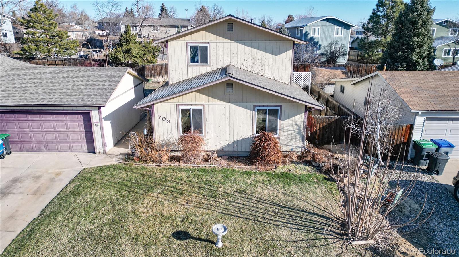 708 Independence Drive Longmont, CO 80504 - Photo 23 of 40 a front view of a house with a yard