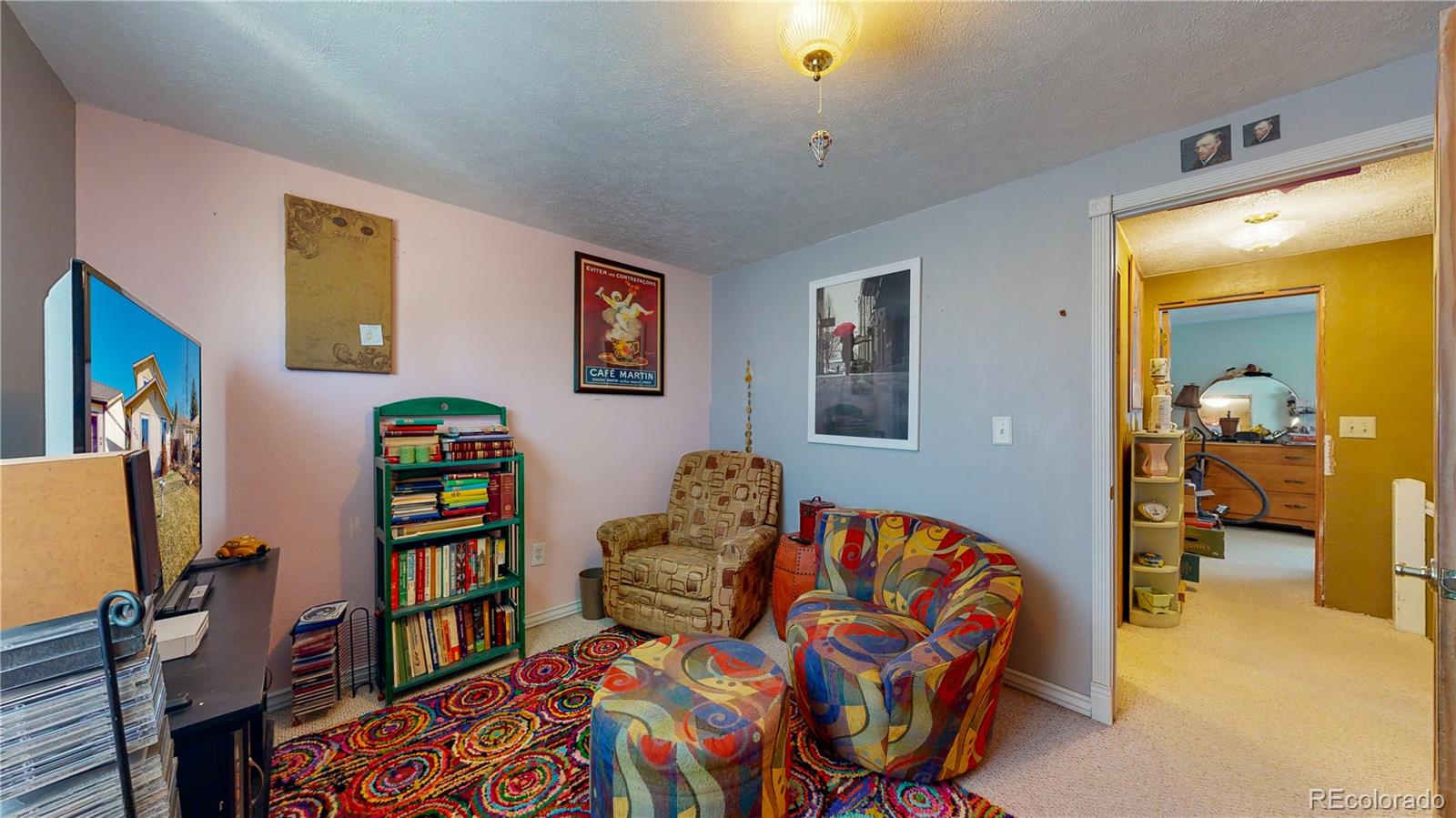 708 Independence Drive Longmont, CO 80504 - Photo 26 of 40 a bedroom with furniture and a book shelf