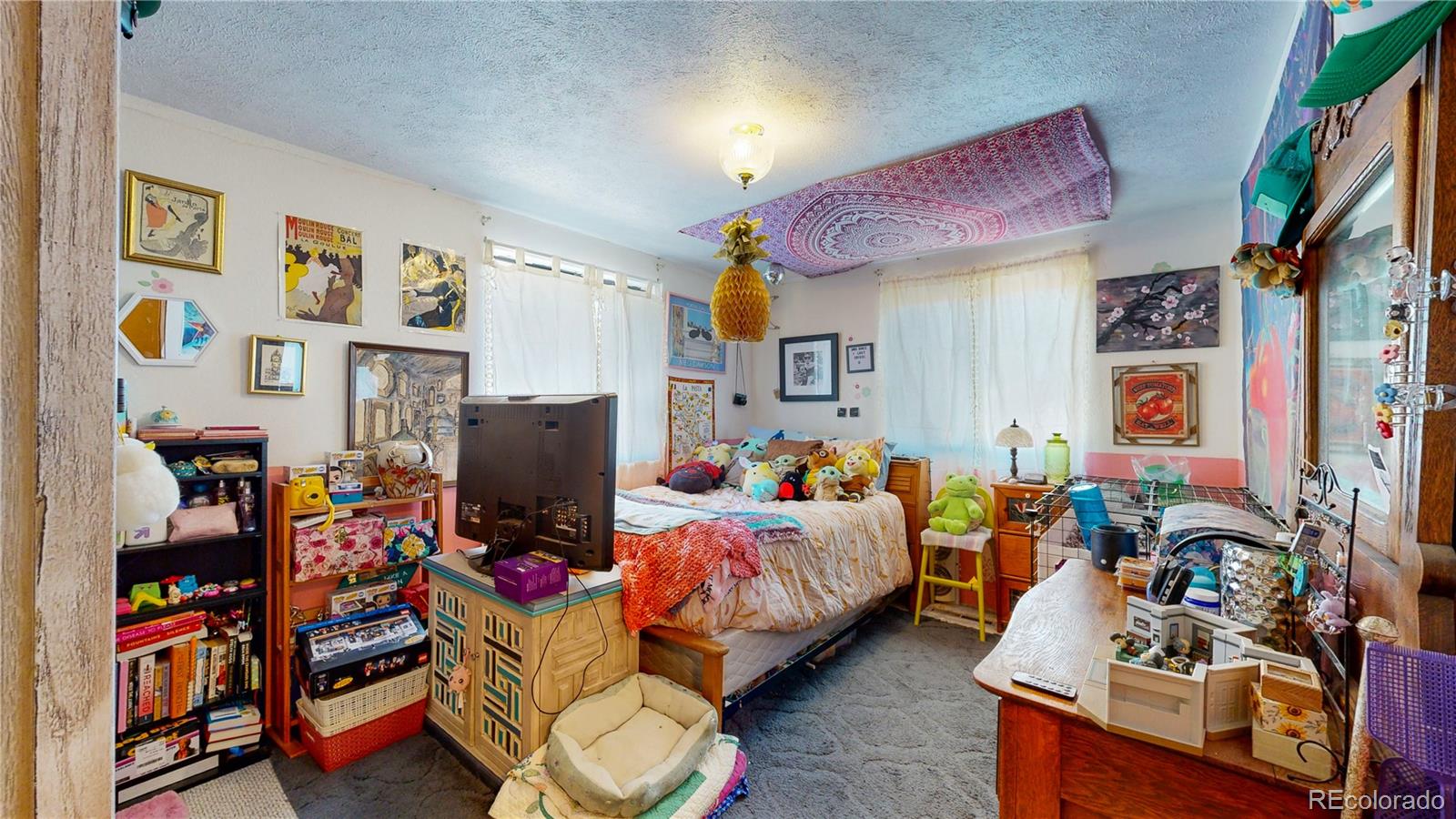 708 Independence Drive Longmont, CO 80504 - Photo 28 of 40 a bedroom with bed and a couch