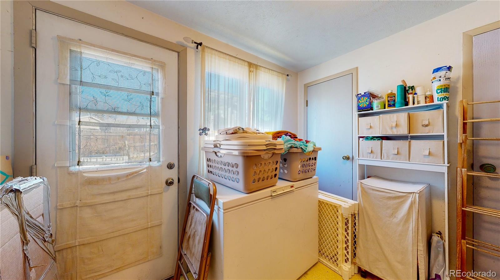 708 Independence Drive Longmont, CO 80504 - Photo 31 of 40 a room with storage and utility