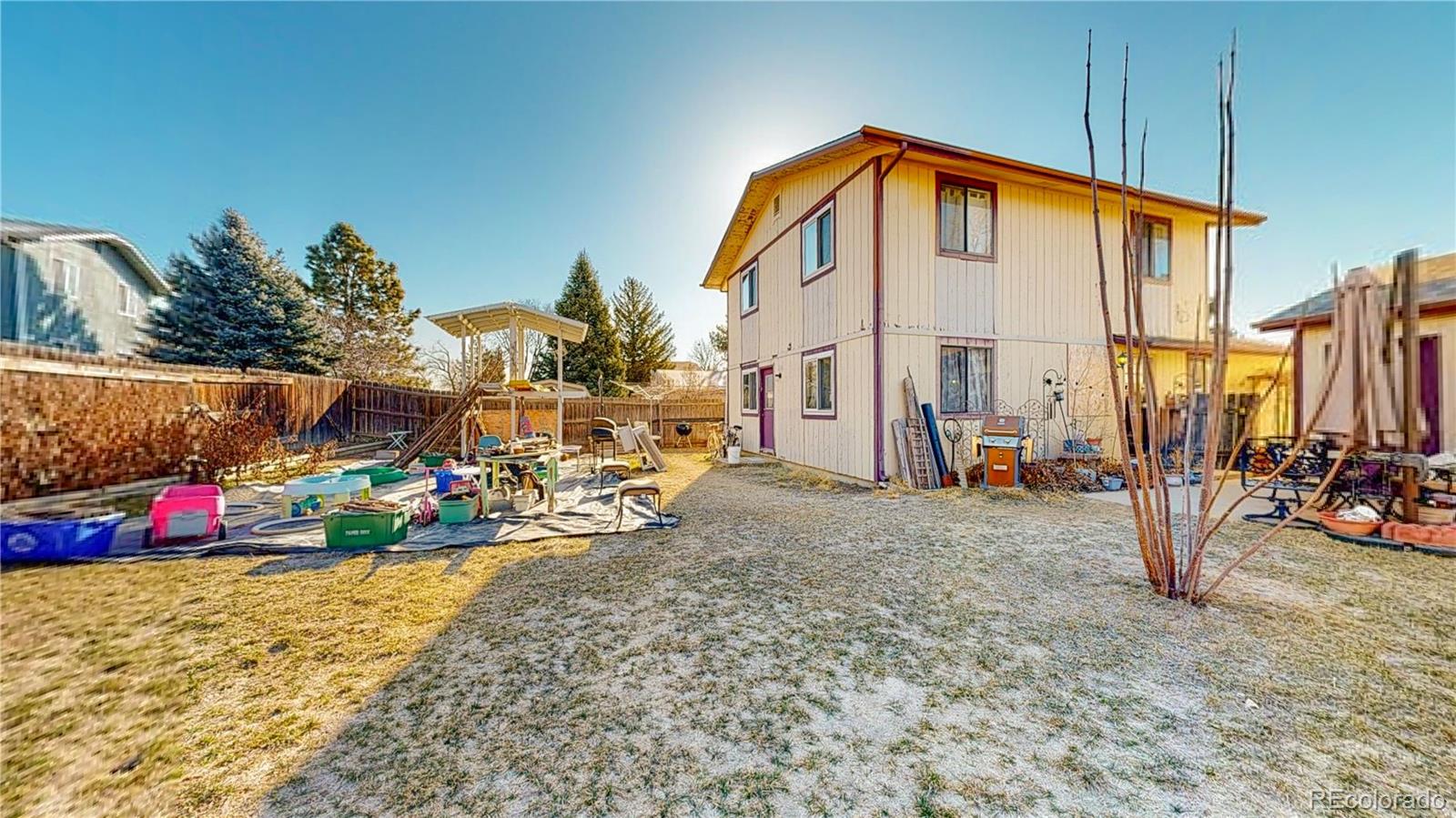 708 Independence Drive Longmont, CO 80504 - Photo 37 of 40 a view of a house with a patio