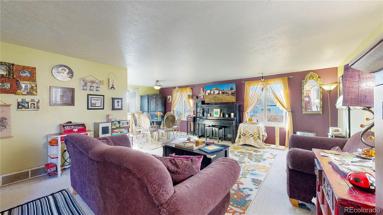 708 Independence Drive Longmont, CO 80504 - Photo 5 of 40 a living room with furniture and a large window