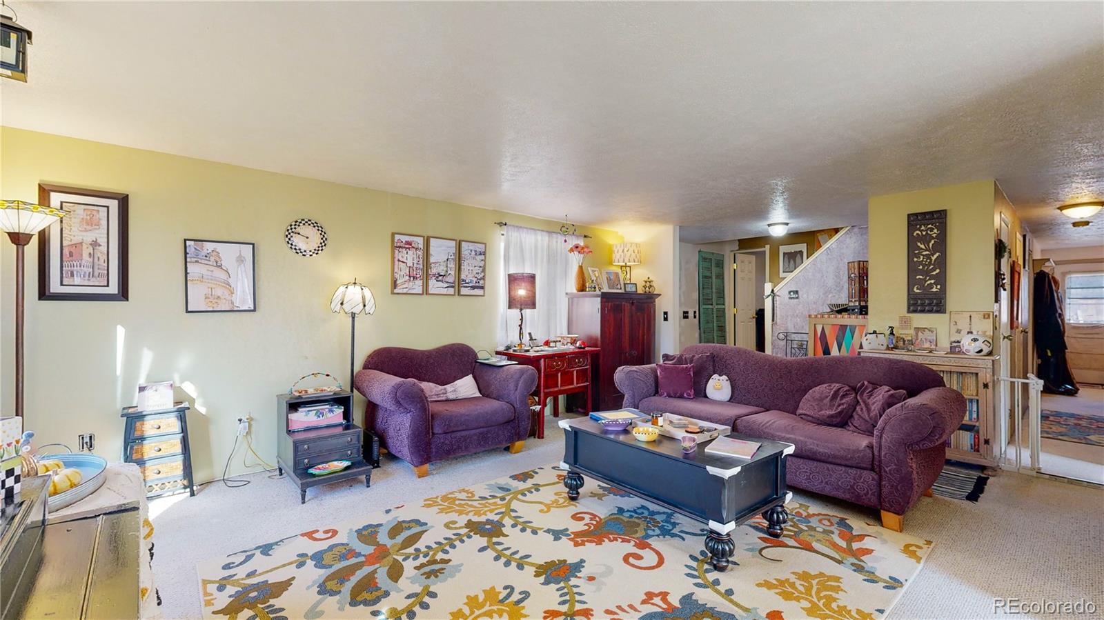 708 Independence Drive Longmont, CO 80504 - Photo 6 of 40 a living room with furniture and a rug