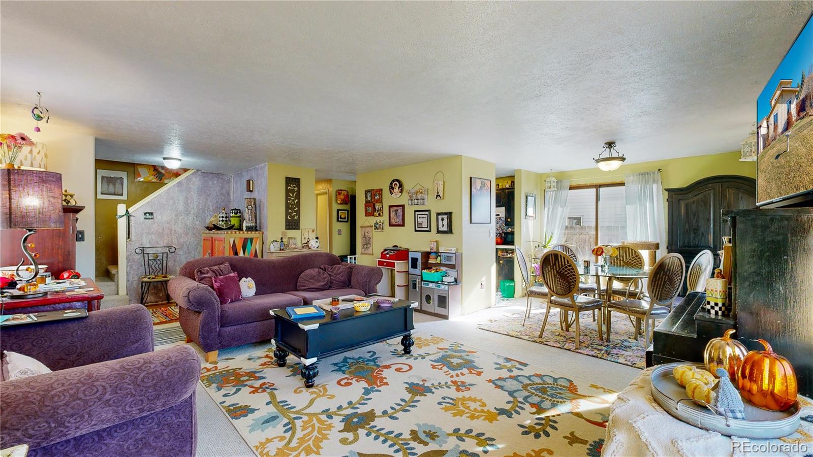 708 Independence Drive Longmont, CO 80504 - Photo 7 of 40 a living room with furniture and a rug