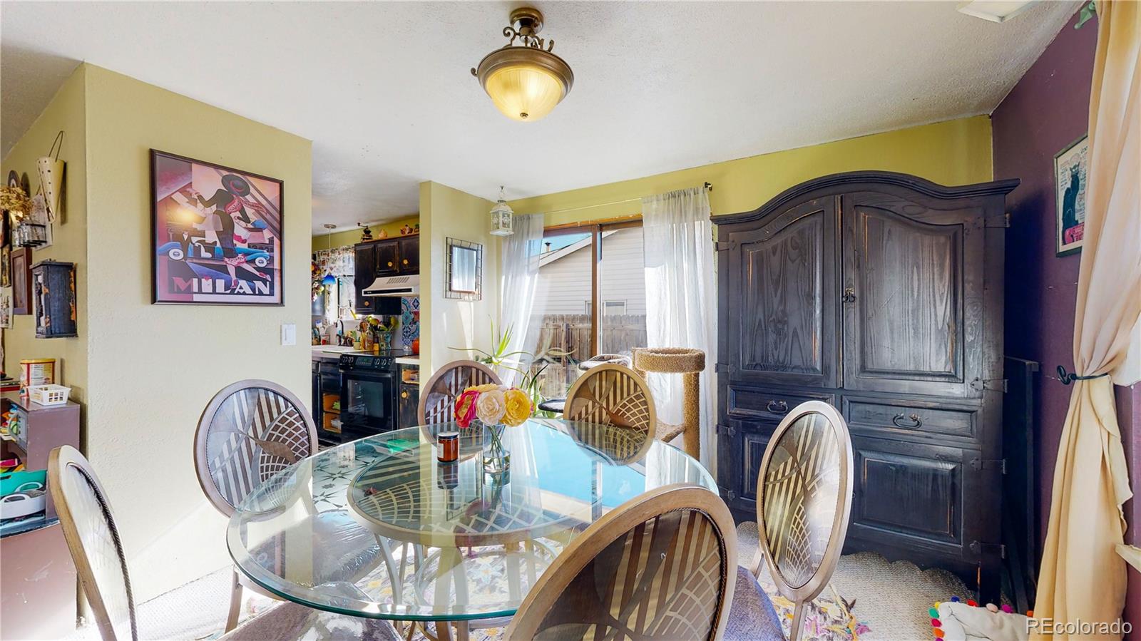 708 Independence Drive Longmont, CO 80504 - Photo 8 of 40 a dining room with furniture and natural light