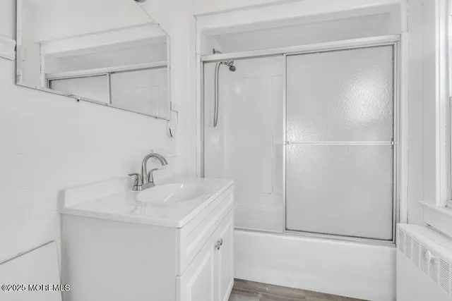 a bathroom with a sink and mirror