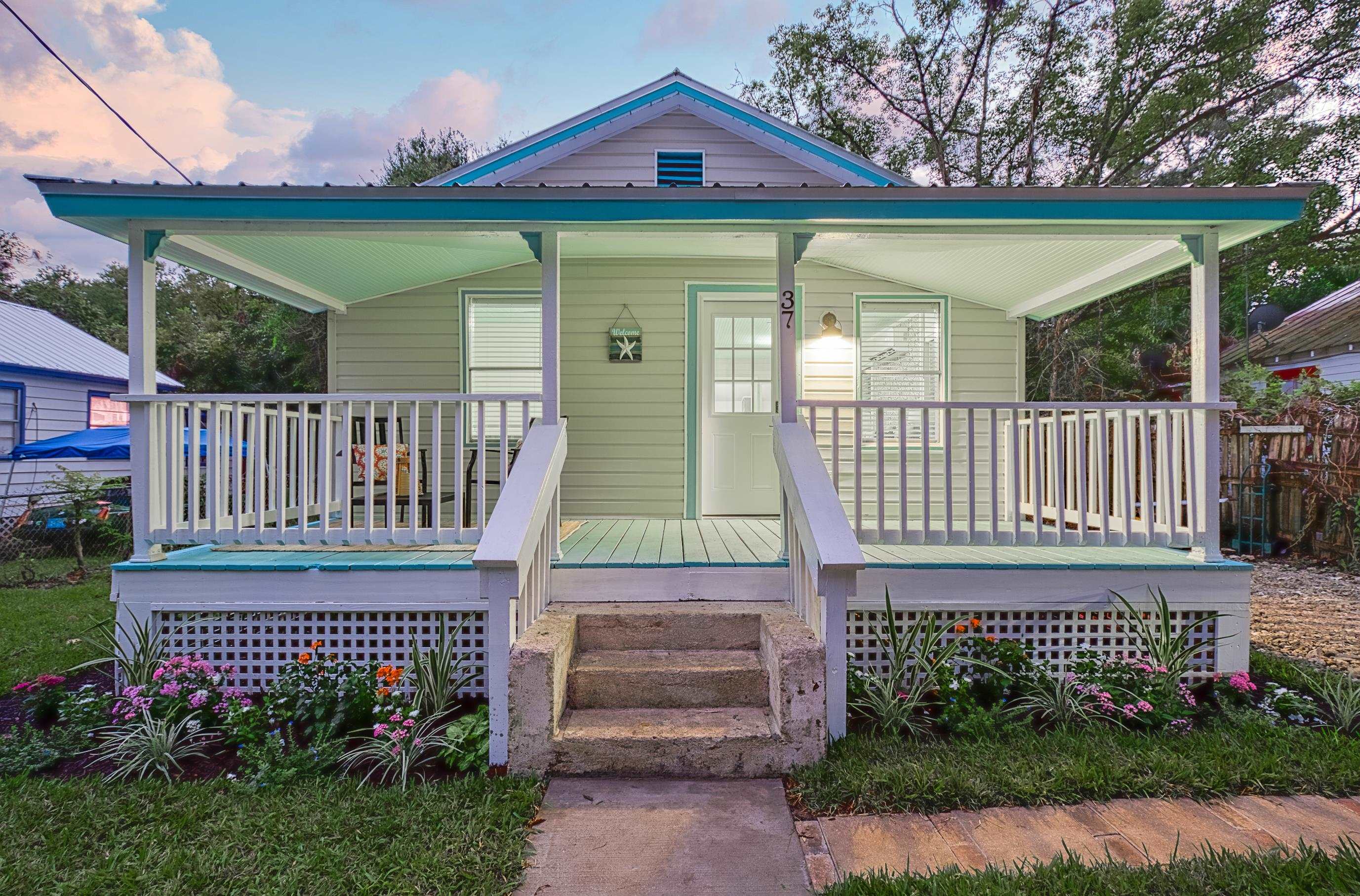 37 Phillips Street St. Augustine, FL 32084 - Photo 2 of 26 a view of a deck with a garden