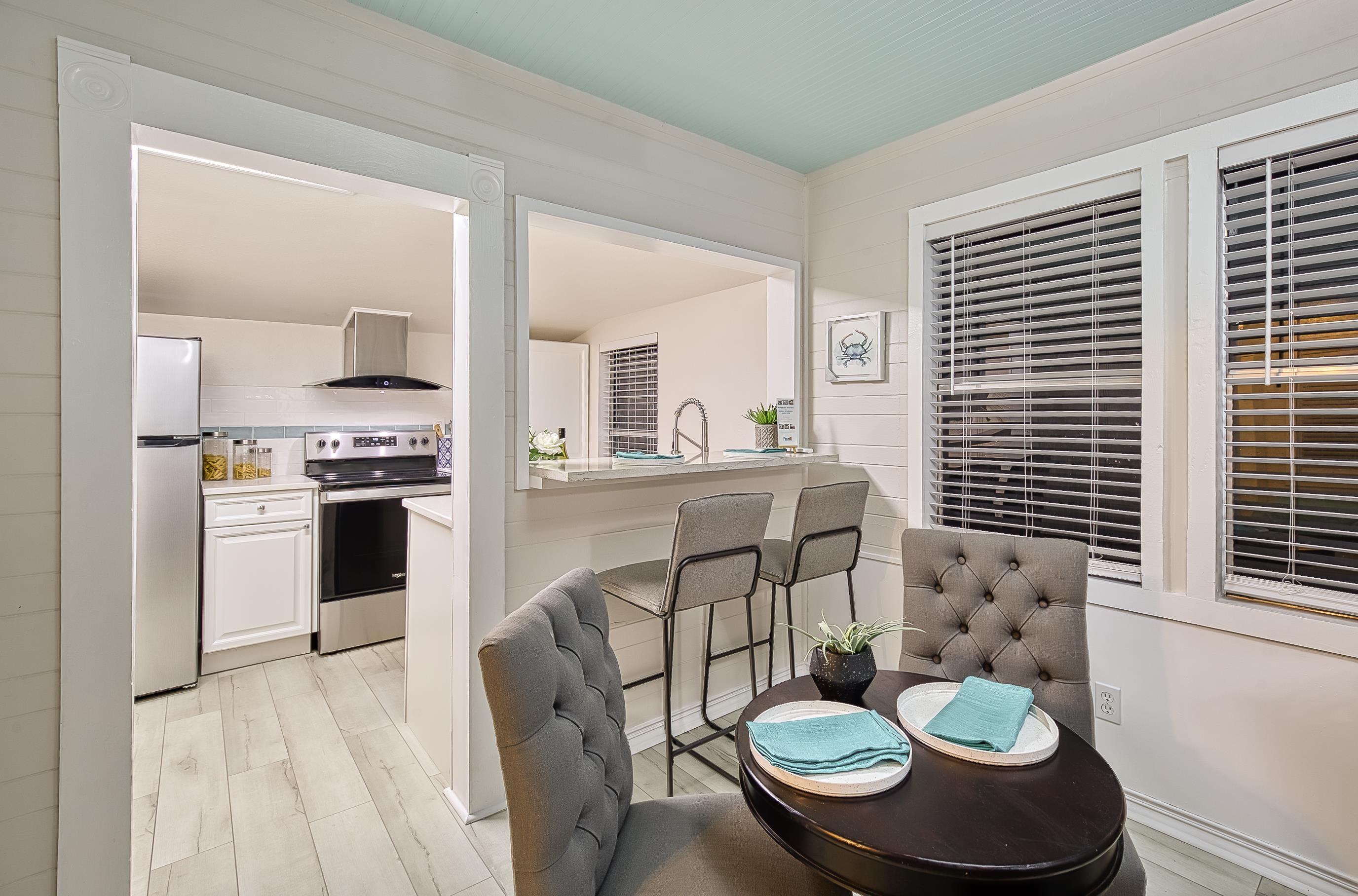 37 Phillips Street St. Augustine, FL 32084 - Photo 11 of 26 a kitchen with kitchen island stainless steel appliances a table and chairs