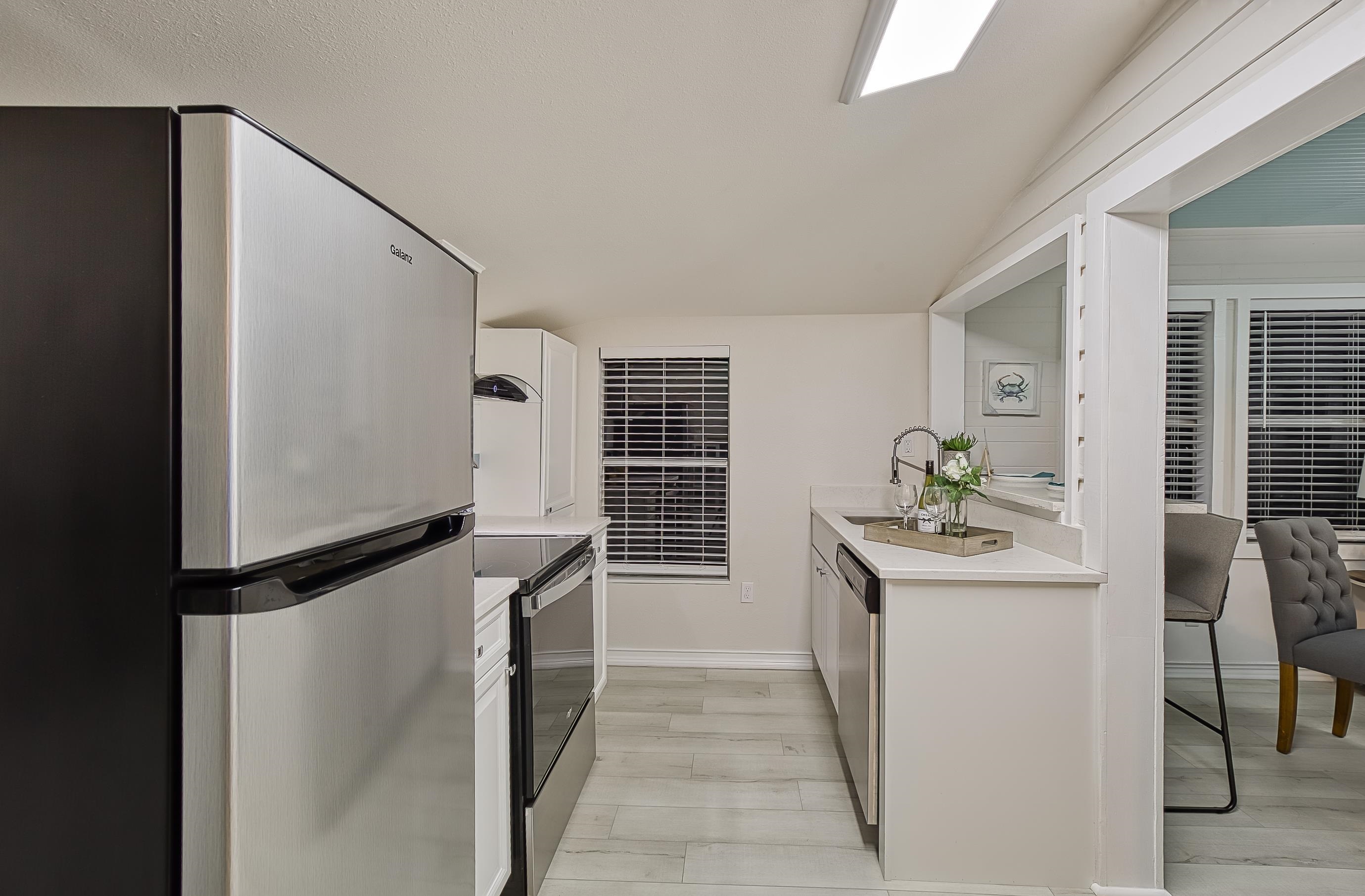 37 Phillips Street St. Augustine, FL 32084 - Photo 16 of 26 a kitchen with stainless steel appliances granite countertop a sink and a refrigerator
