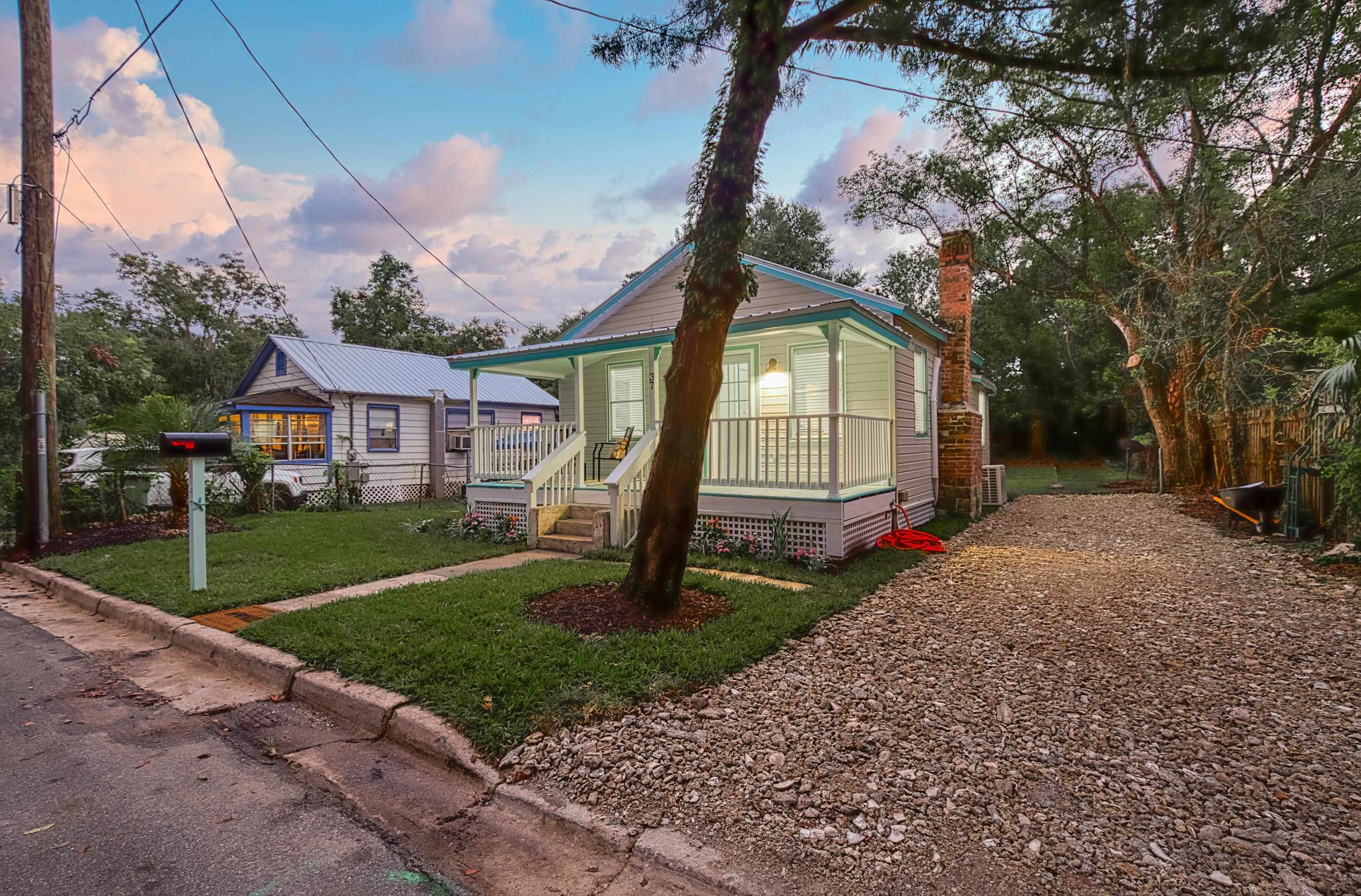 37 Phillips Street St. Augustine, FL 32084 - Photo 3 of 26 a front view of a house with garden